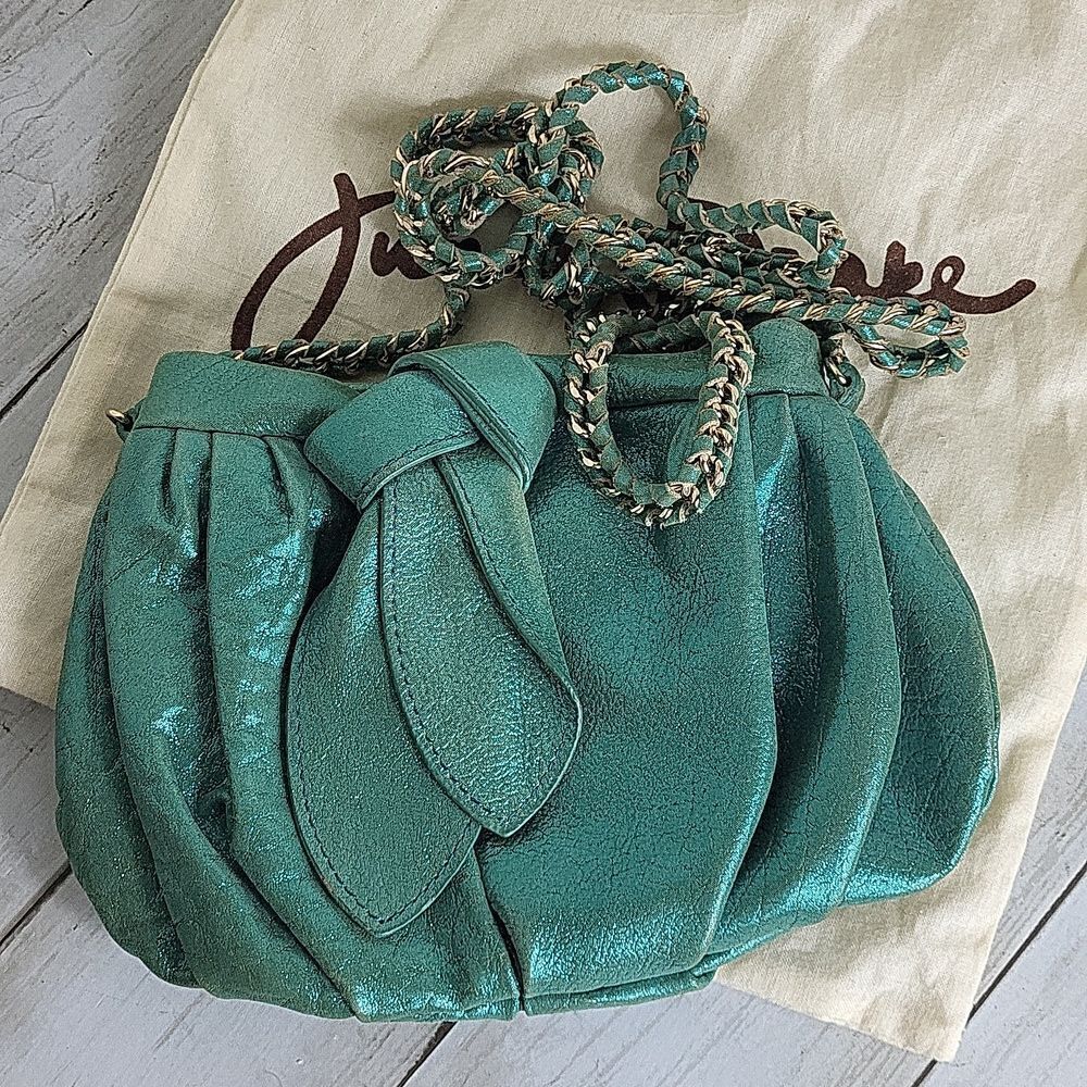 Junior Drake Shiny turquoise cross shoulder bag.